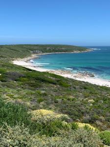 a view of a beach and the ocean at Romansbaai Collection in Gansbaai