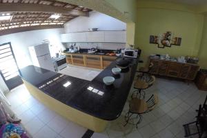 an aerial view of a kitchen with a counter top at Pousada Marraial in Arraial d'Ajuda