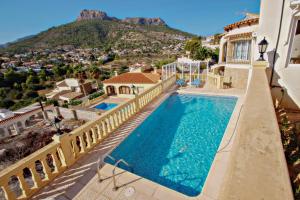 an aerial view of a house with a swimming pool at Tosal Julia - sea view villa with private pool in Calpe in Calpe