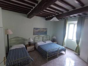 Postel nebo postele na pokoji v ubytování Residence B&B il Connubio