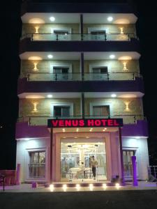 a building with a venus hotel sign in front of it at Venus Hotel in Wadi Musa