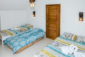Säng eller sängar i ett rum på Forest Paradise - four bedroom villa