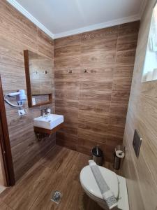 Koupelna v ubytování Abella Hotel