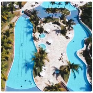 an aerial view of the pool at the resort at Flat Beach Class Resort Muro Alto in Porto De Galinhas