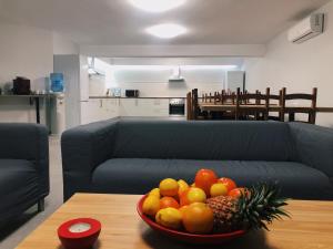 a bowl of fruit on a table in a living room at Villa 8 Islas in Costa Del Silencio