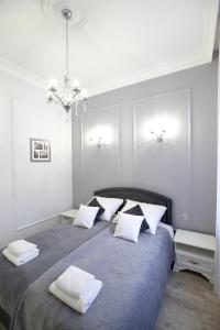 Posteľ alebo postele v izbe v ubytovaní Apartament Kryształowy AC Progres