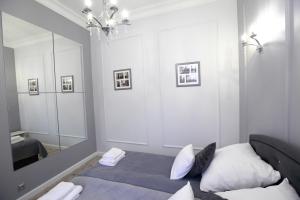 Posteľ alebo postele v izbe v ubytovaní Apartament Kryształowy AC Progres