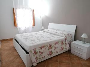 Postel nebo postele na pokoji v ubytování calloni franceschini home