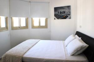 Postel nebo postele na pokoji v ubytování Palm Tree Villas