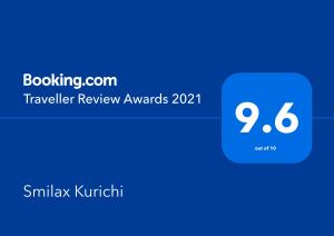 una captura de pantalla de los premios de revisión de viajes con una caja azul en Smilax Kurichi, en Uruma