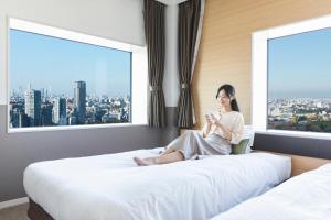 Postel nebo postele na pokoji v ubytování Hotel Crown Hills Ueno Premier