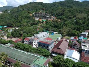 an aerial view of a city with a mountain at The Mantra Hotel Kata Noi in Kata Beach