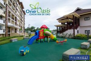 a playground in front of a apartment building at One Oasis Apartment CDO in Cagayan de Oro