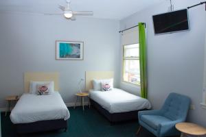 מיטה או מיטות בחדר ב-Grand Hotel Rockdale