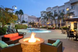 a fire pit in a courtyard with chairs and tables at Staybridge Suites Phoenix Glendale Sports Dist, an IHG Hotel in Glendale