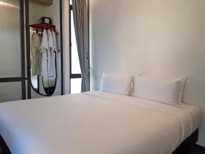 Postel nebo postele na pokoji v ubytování Wonderwall Hotel