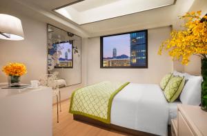 Ліжко або ліжка в номері Hotel Pravo Hong Kong