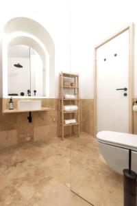 a bathroom with a sink and a toilet and a mirror at ViilA Cheia in Cheia