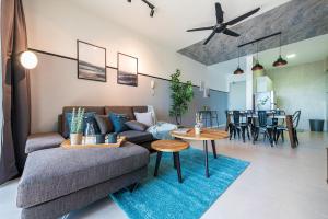 a living room with a couch and a table at Time To Relax v 3BR Geo Bukit Rimau,Shah Alam by Verano in Shah Alam