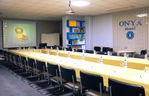 a large conference room with a long table and chairs at Onyx Hotel Bishkek in Bishkek