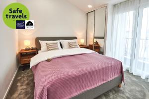 Postel nebo postele na pokoji v ubytování Perla Residence Hotel & SPA