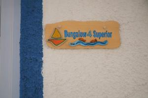 a sign on a wall with a sailboat on it at Summer Residence in Provatas