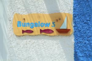 a sign for a bed with a sailboat on it at Summer Residence in Provatas