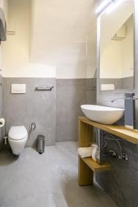 a bathroom with a sink and a toilet at Apartment Bolzano in Bolzano +28 photos