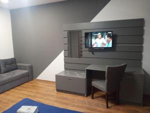 Μια τηλεόραση ή/και κέντρο ψυχαγωγίας στο Нова квартира в центрі міста