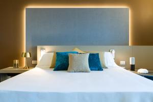Voodi või voodid majutusasutuse Seawater Hotel Bio & Beauty Spa toas