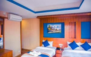 Krevet ili kreveti u jedinici u objektu Himalayan Suite Hotel