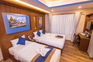 Krevet ili kreveti u jedinici u objektu Himalayan Suite Hotel