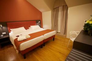 Postel nebo postele na pokoji v ubytování Hotel Concord