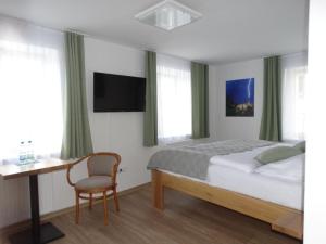 Postel nebo postele na pokoji v ubytování Hotel Garni Villa Areka