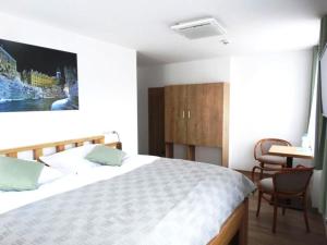Postel nebo postele na pokoji v ubytování Hotel Garni Villa Areka