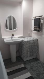 Een badkamer bij Гостьовий будиночок