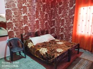 Postel nebo postele na pokoji v ubytování Success Hostel