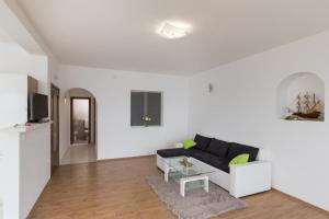Televízia a/alebo spoločenská miestnosť v ubytovaní Apartment Manuela
