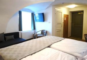 Postel nebo postele na pokoji v ubytování Hotel Garni Villa Areka