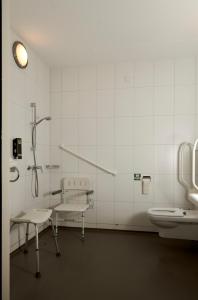 a bathroom with a toilet and a sink at Star Lodge Hotels in Utrecht