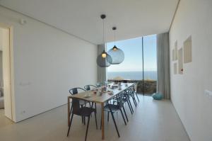 a dining room with a long table and chairs at VILLA BONITA - REF 216 in Begur