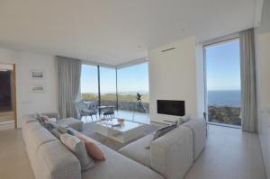 a living room with a couch and a tv at VILLA BONITA - REF 216 in Begur