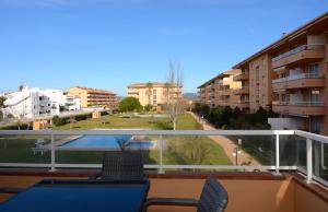 a balcony with a view of a city at Golf Mar II A 1-4 in Pals