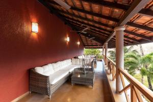 a living room with a couch and a table at Lazy Lagoon, Baga A Lemon Tree Resort, Goa in Baga