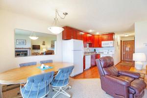 a kitchen and dining room with a table and chairs at AHoy Matey Condo in Moclips