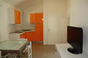A kitchen or kitchenette at Villaggio Solveig Family Apartments Még 2 kép