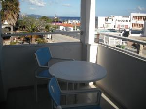 a table and two chairs on a balcony with a view at Antonis Hotel in Kefalos