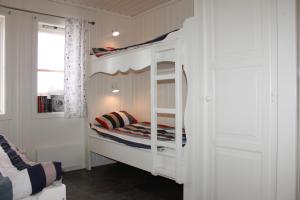 a white bunk bed in a room with a window at Malungs Camping in Malung +72 photos