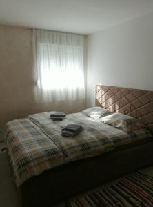 Postel nebo postele na pokoji v ubytování Apartman studio Jovan