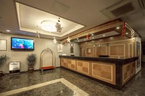 TV a/nebo společenská místnost v ubytování Yücesoy Liva Hotel Spa & Convention Center Mersin